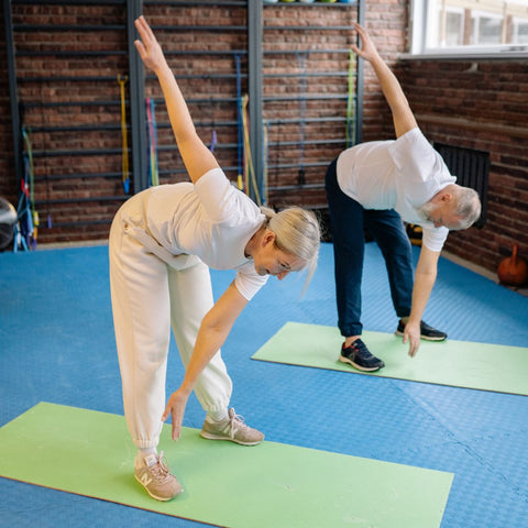 Two older people exercising